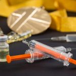 some of injections and bottles on the table