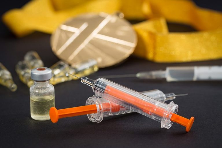 some of injections and bottles on the table