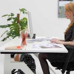 A girl sitting on chair and operating system work